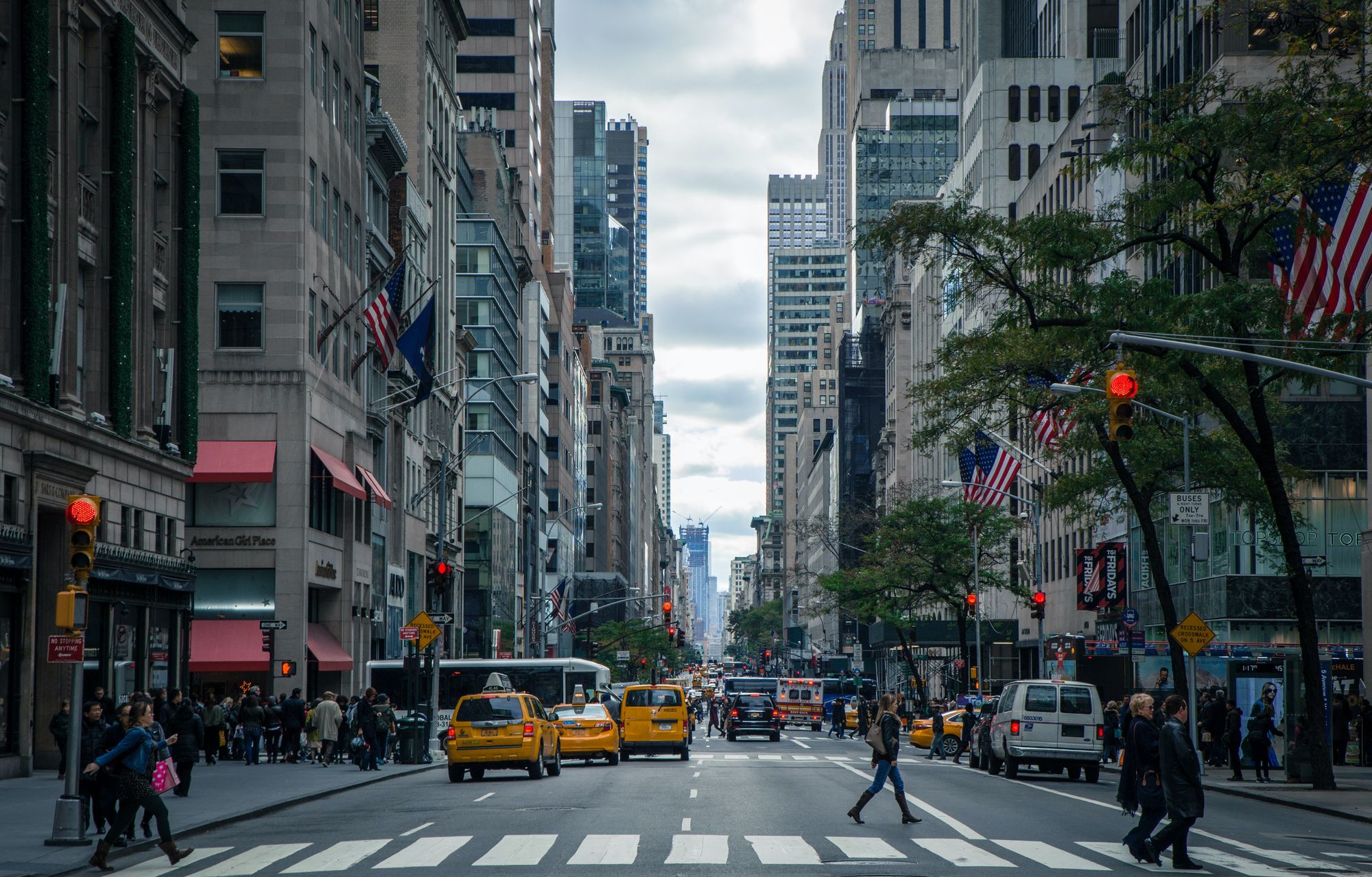 A road in New York with taxi cars.